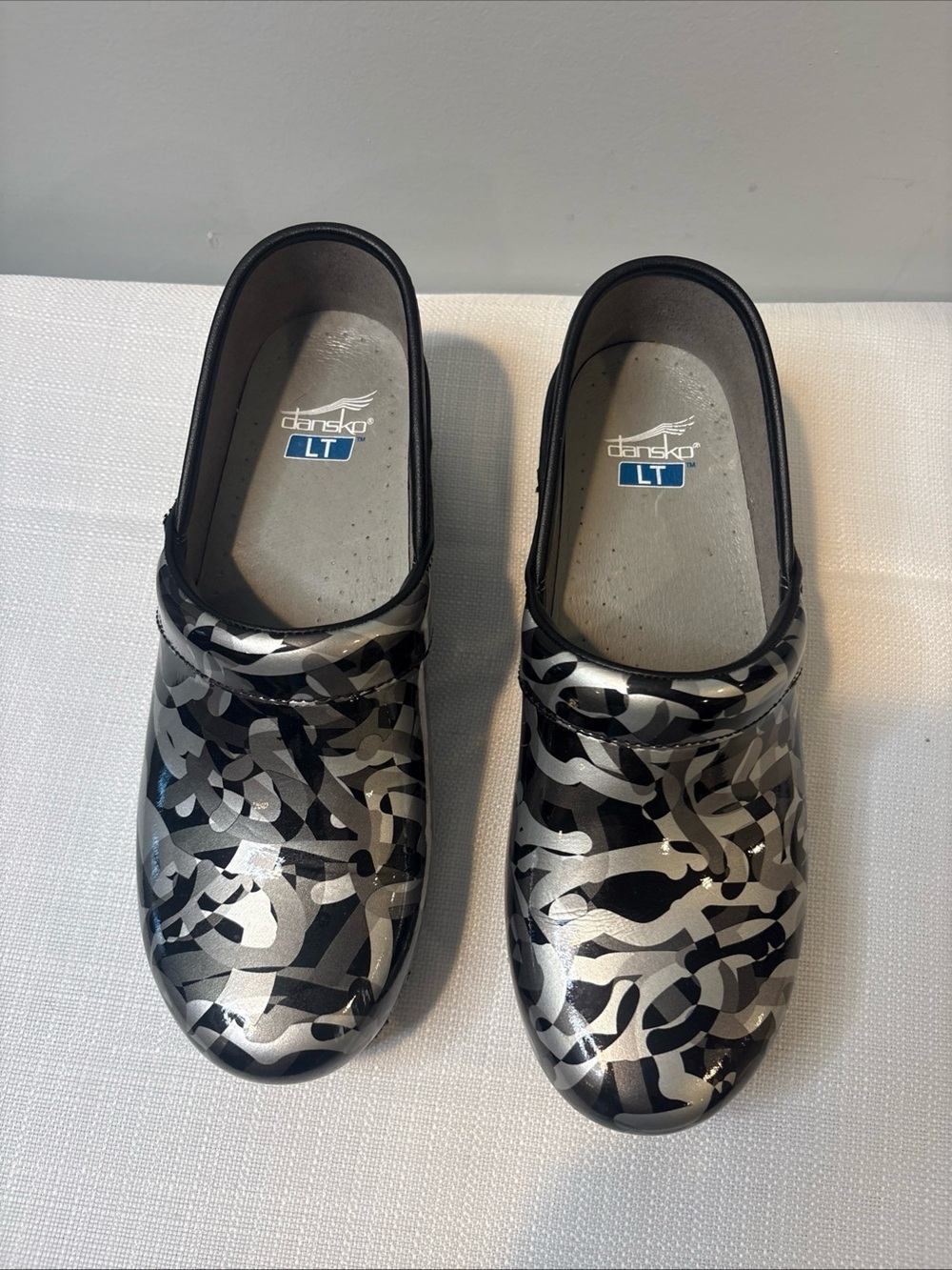 Dansko Women’s Black and Silver Patterned Slip-On Clogs